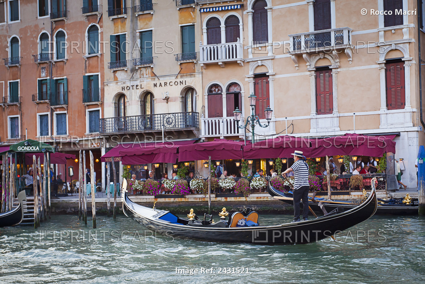 A Gondolier In A Gondola Outside Hotel Marconi; Venice, Italy